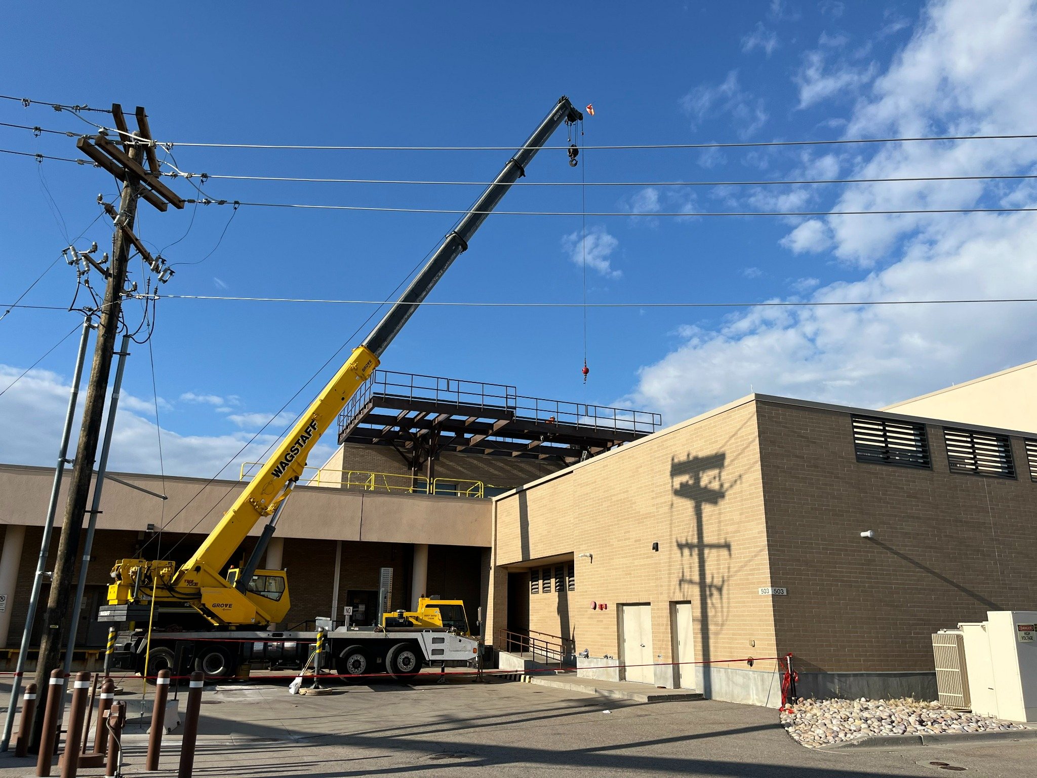 JDS Fabrication crane setting structural steel on a commercial project